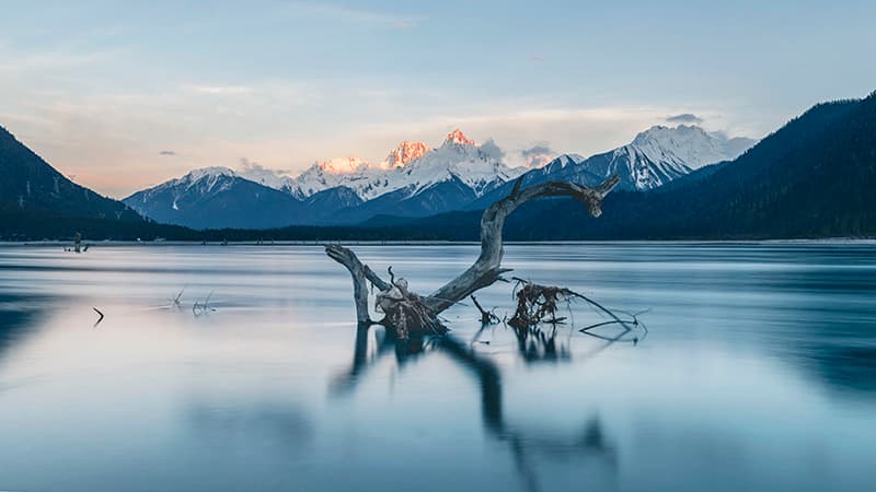 Guxiang Lake — tranquil glacial lake reflecting surrounding mountains
