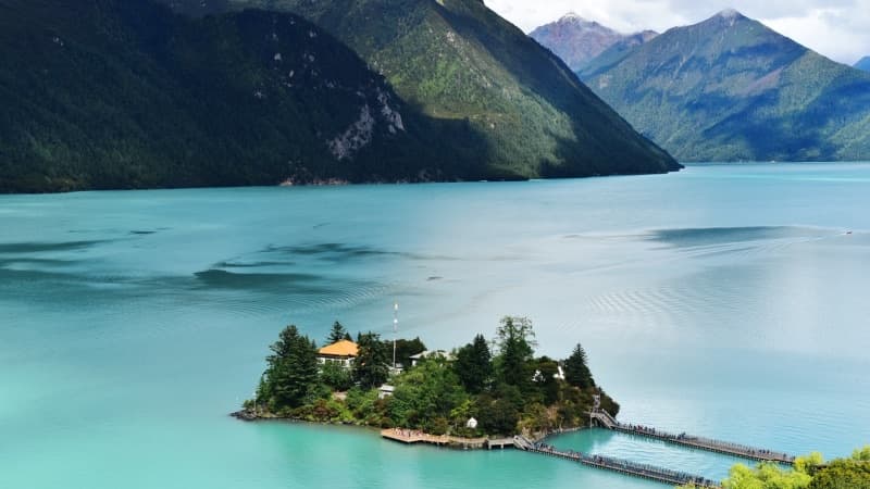 Basomtso Lake — pristine alpine waters surrounded by forest peaks
